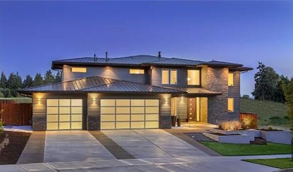 Commercial Garage Door Repair — House with Garage Door at Night in Lomita, CA