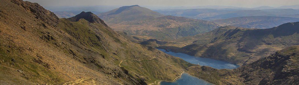 Welsh mountain scene with natural lakes at their base.