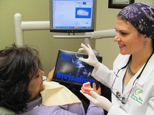 Dr. Abdelrazek with patient; Our Philosophy