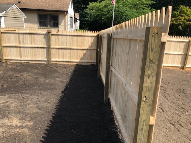 Lawn with Fence — Long Island, NY — Bamboo Removal and Landscaping Design in Long Island by Jose Benitez