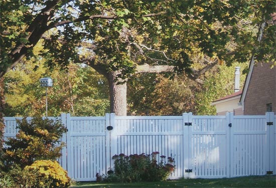 Vinyl Fencing — PVC Fence and a Tree in Grand Rapids, MI