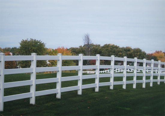 Vinyl Fencing Installation — PVC Fence on a Grass in Grand Rapids, MI