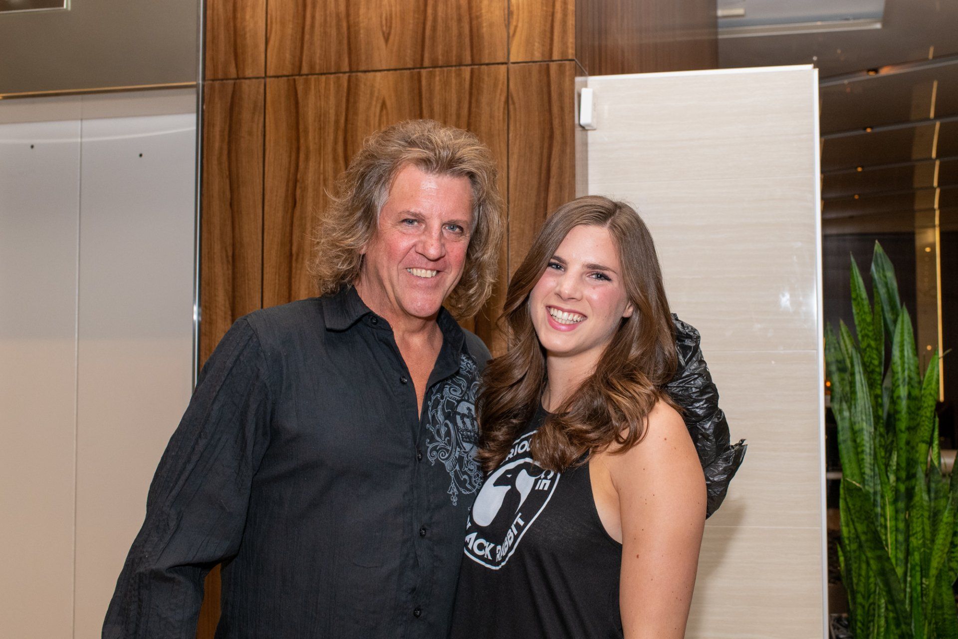 A man and a woman are posing for a picture together.