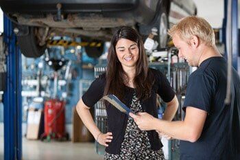 Happy customer and mechanic Happy customer and mechanic