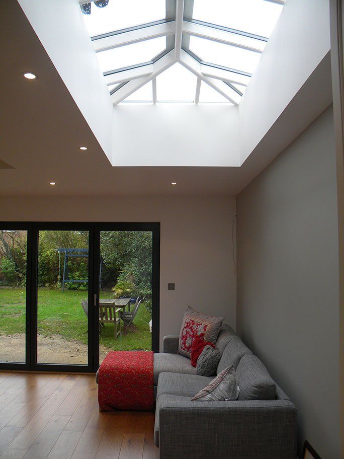 A renovation that included an extension and has glass floor to ceilings doors.
