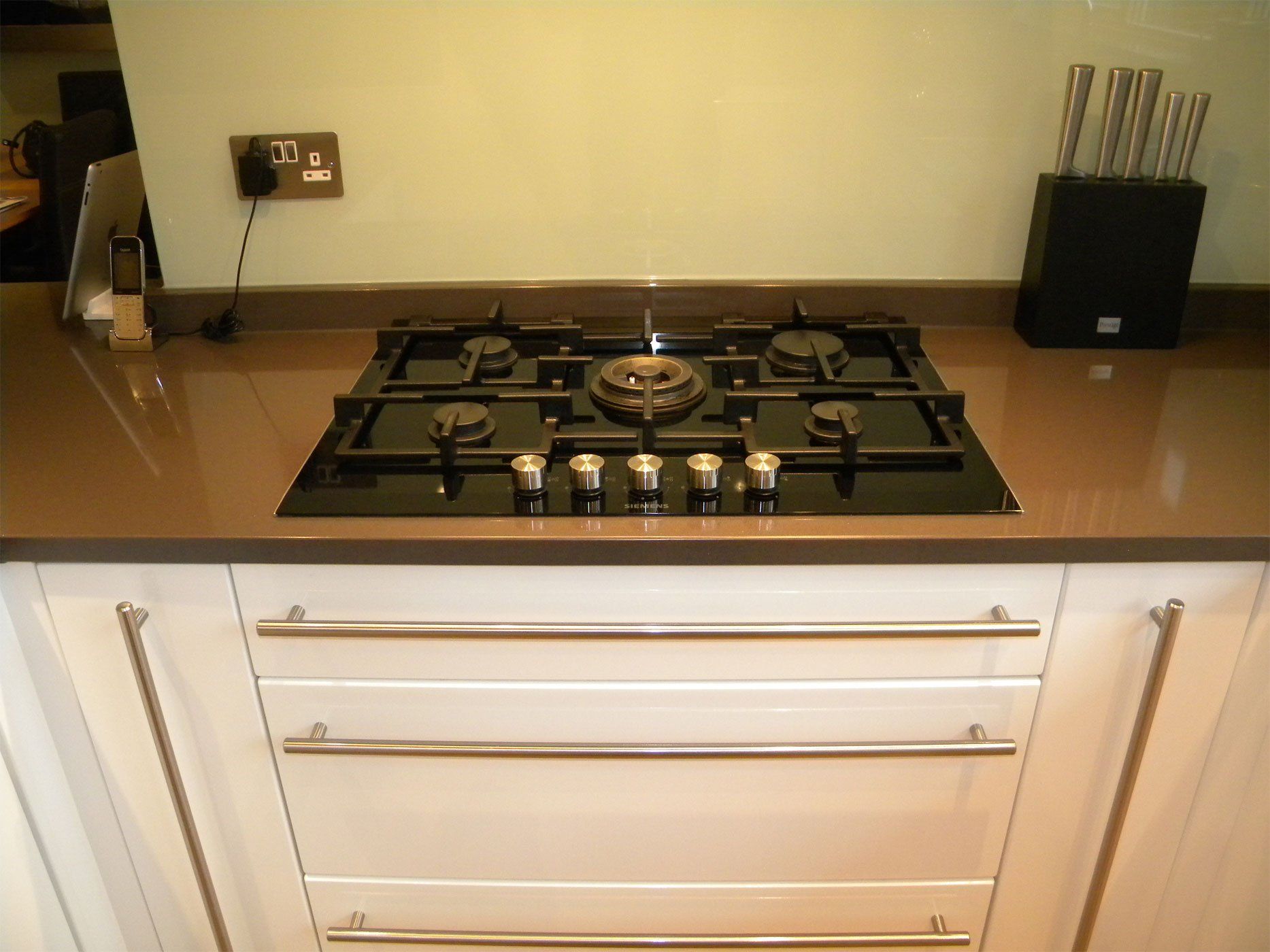 White kitchen with new hob installation.