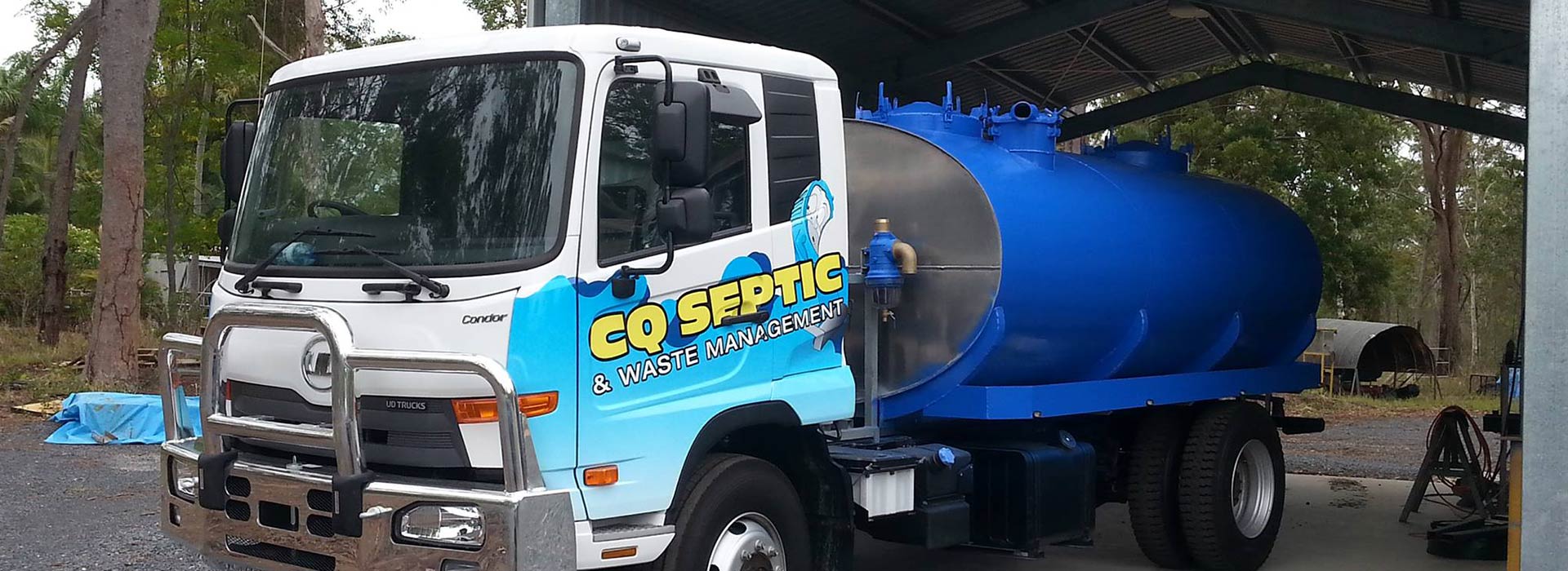 A blue and white truck with the word go septic on the side