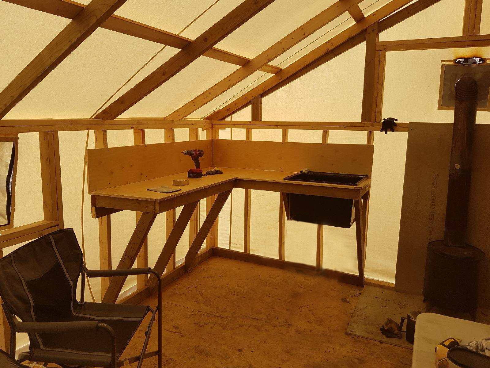 A room with a chair and a sink in it