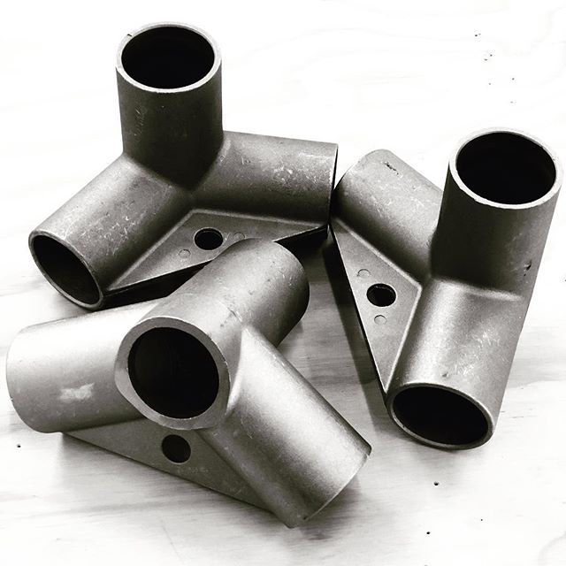 A bunch of metal pipes are stacked on top of each other
