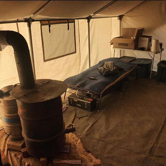 A tent with a box on the table that says denso