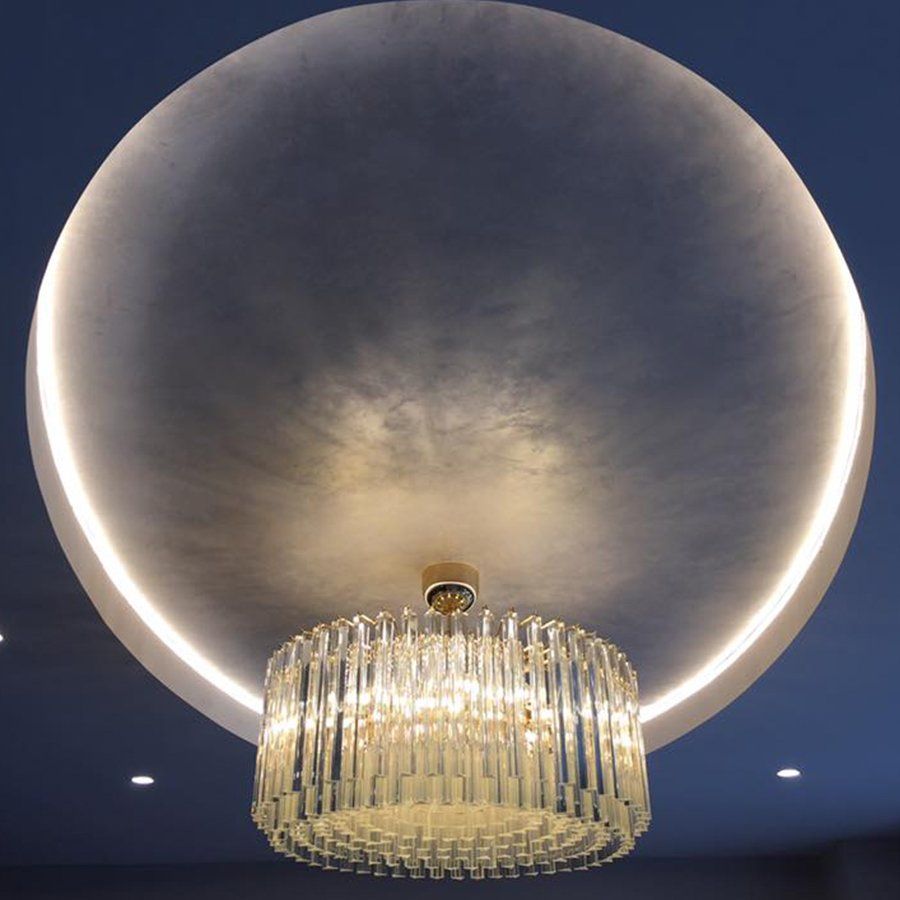 dark blue ceiling with gold chandellier