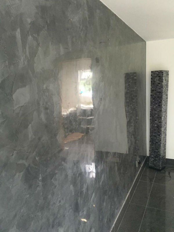 venetian plastery shiny marble wall in dark grey