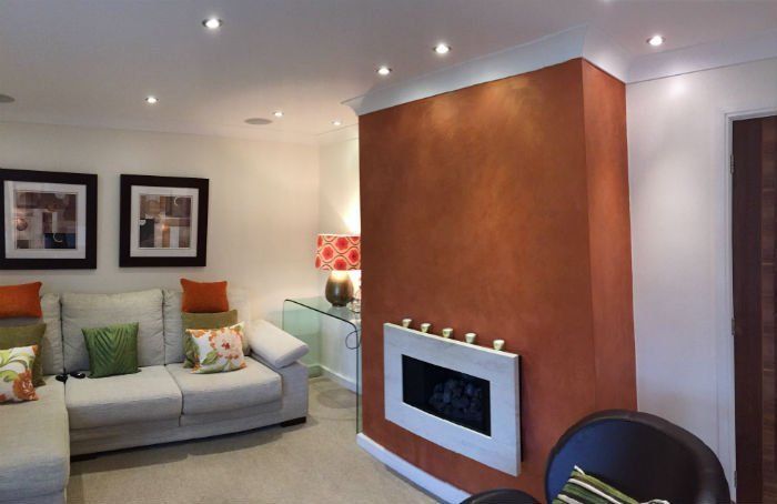venetian plastery white and orange design of a room