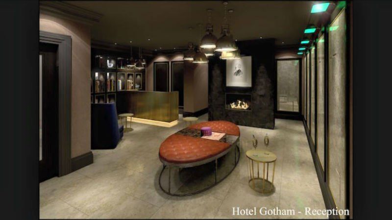 venetian plastery dark grey room with orange table