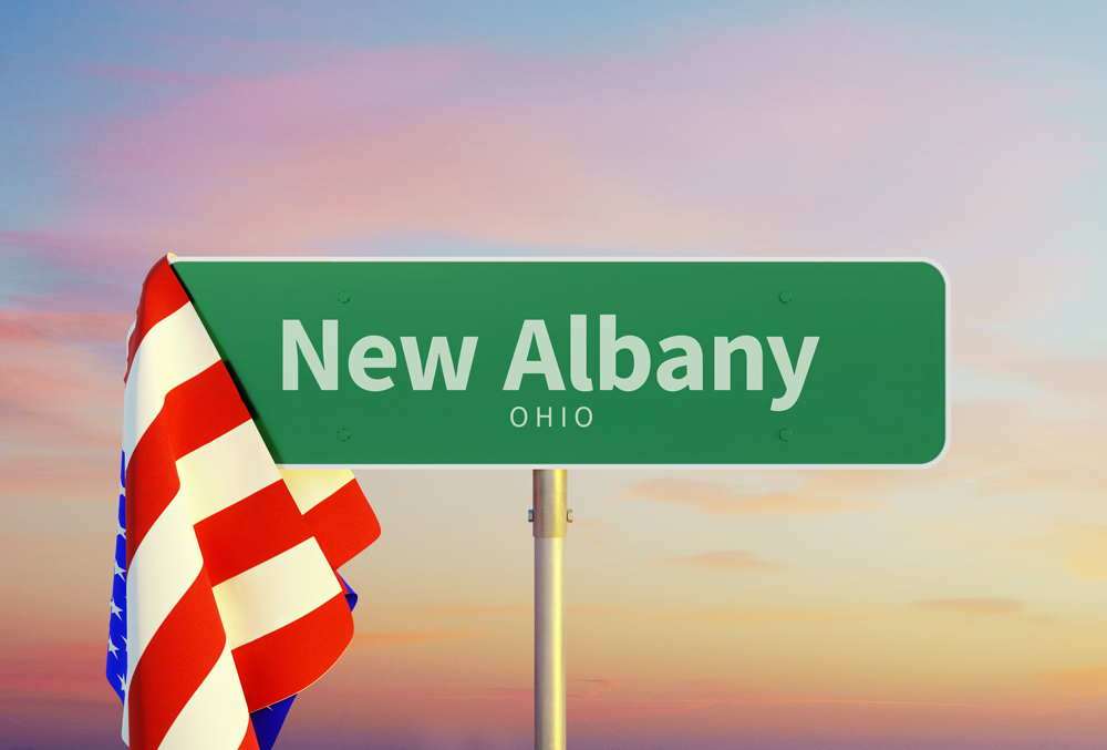 A green street sign for New Albany Ohio