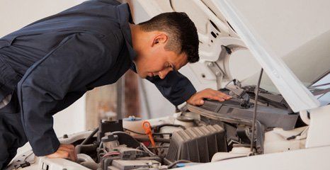 Mechanic servicing a car