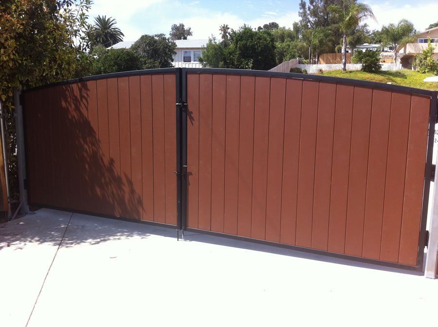 Driveway Gate With House Decoration — Ste. K Santee, CA — Sam's Fencing Inc.