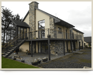 House with balcony and decorative stonework