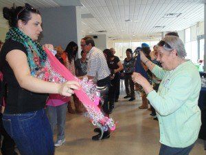 A group of people are dancing together in a room.