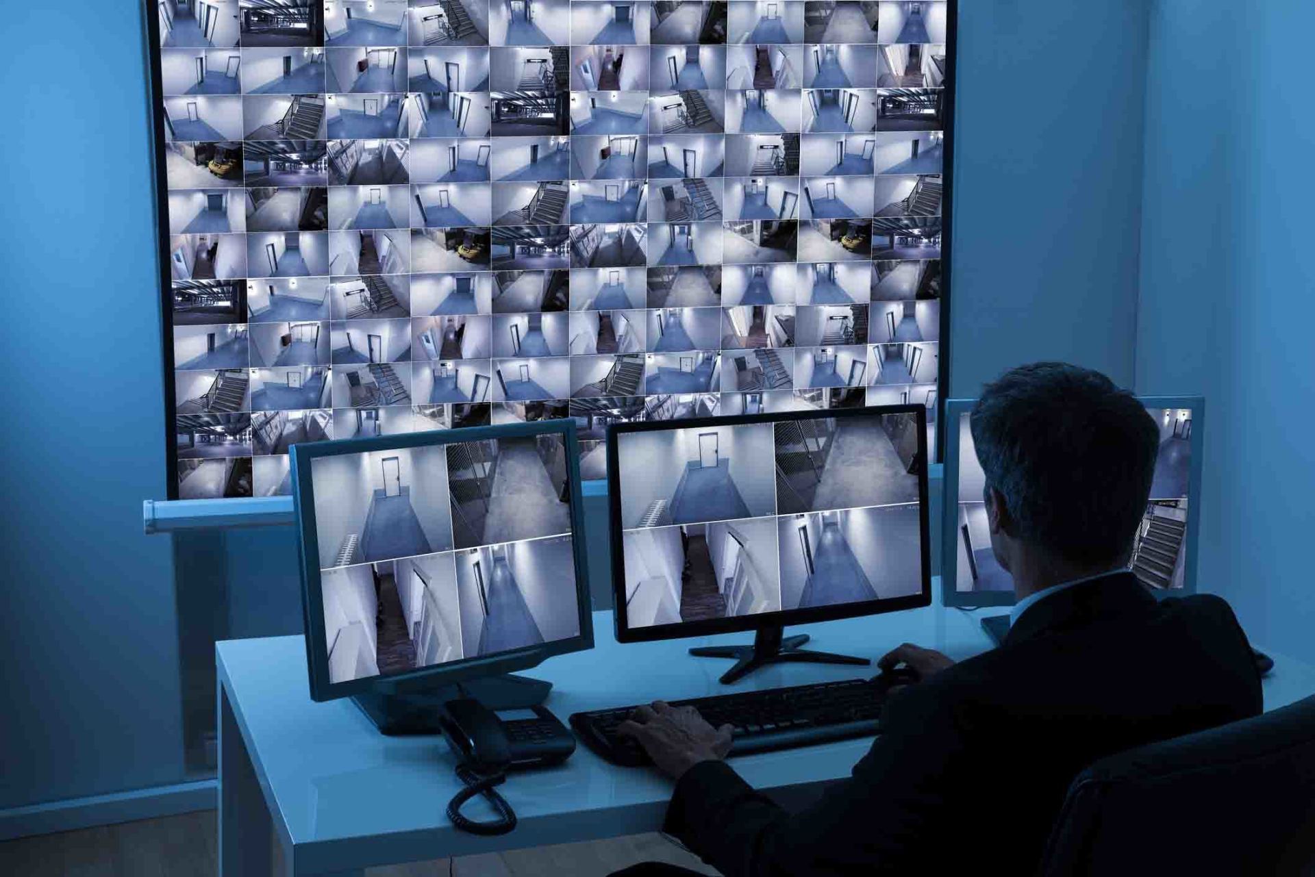 Man In Control Room Monitoring CCTV Footage — West Monroe, LA — DSC Security & Communications LLC Man In Control Room Monitoring CCTV Footage — West Monroe, LA — DSC Security & Communications LLC