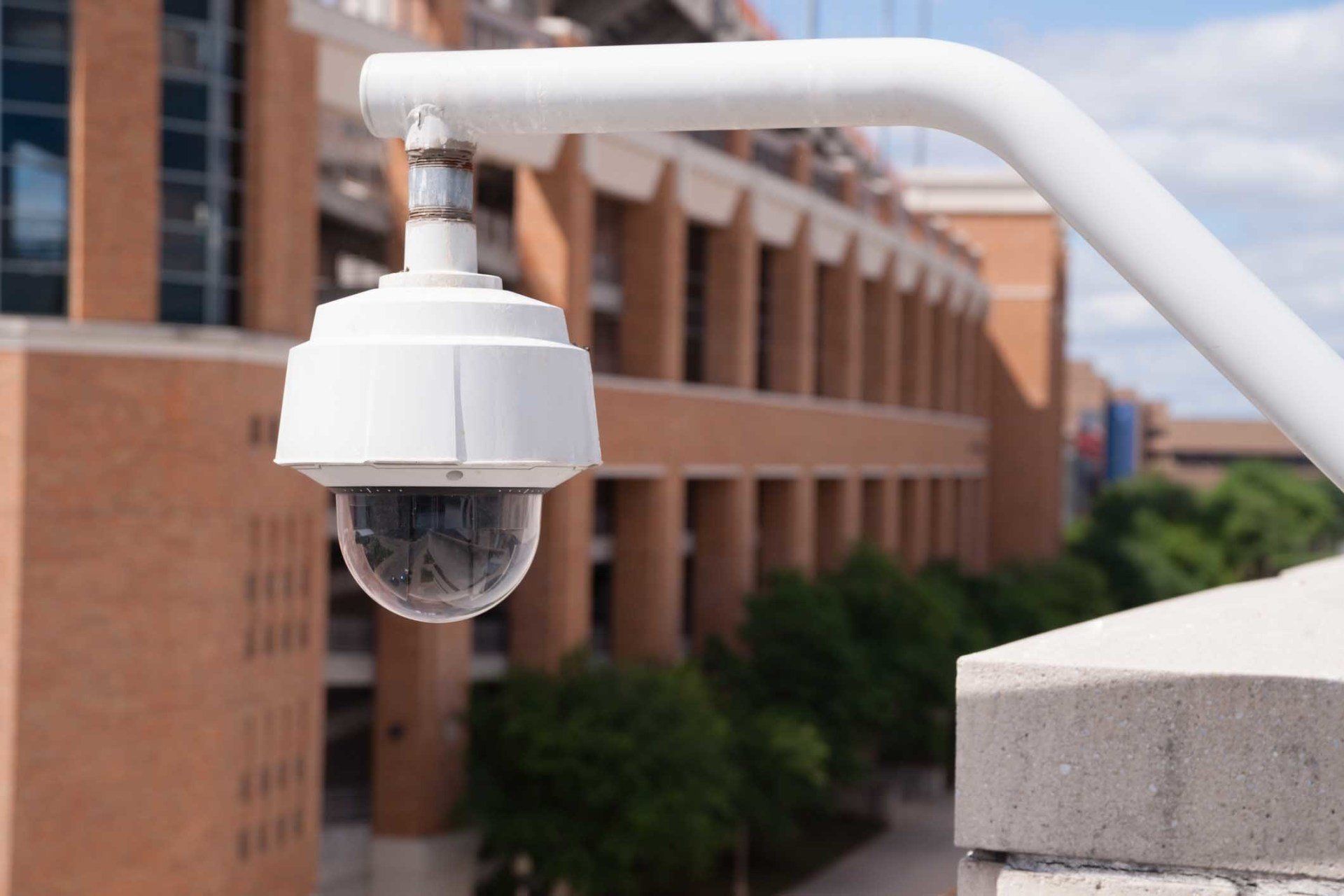 Video Security Camera Housing Mounted High on College Campus — West Monroe, LA — DSC Security & Communications LLC Video Security Camera Housing Mounted High on College Campus — West Monroe, LA — DSC Security & Communications LLC