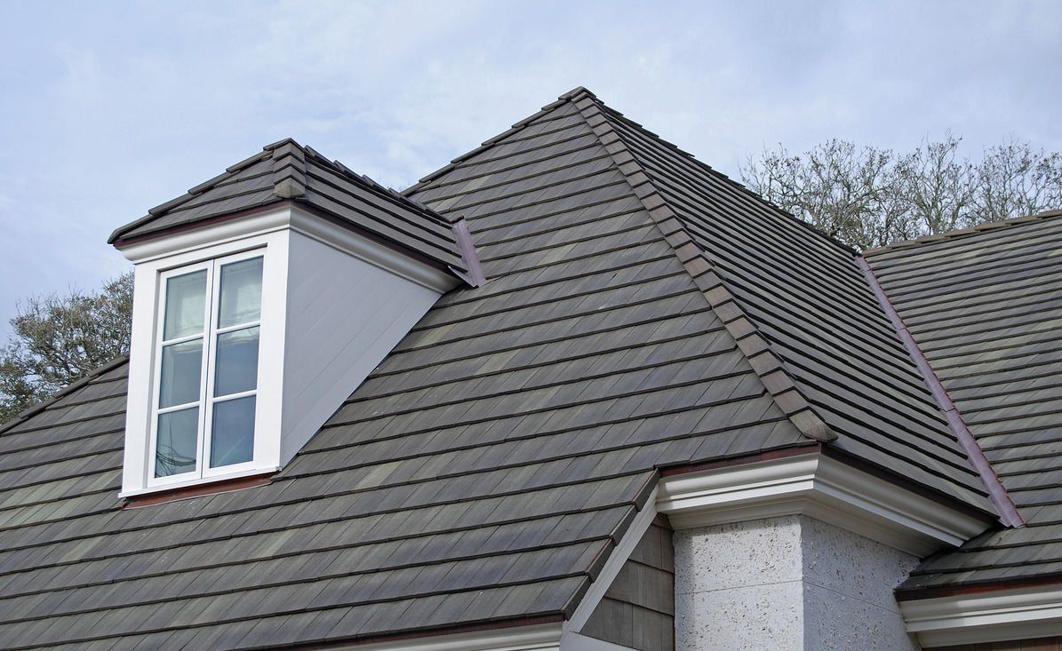 A house with a roof that has a window on it