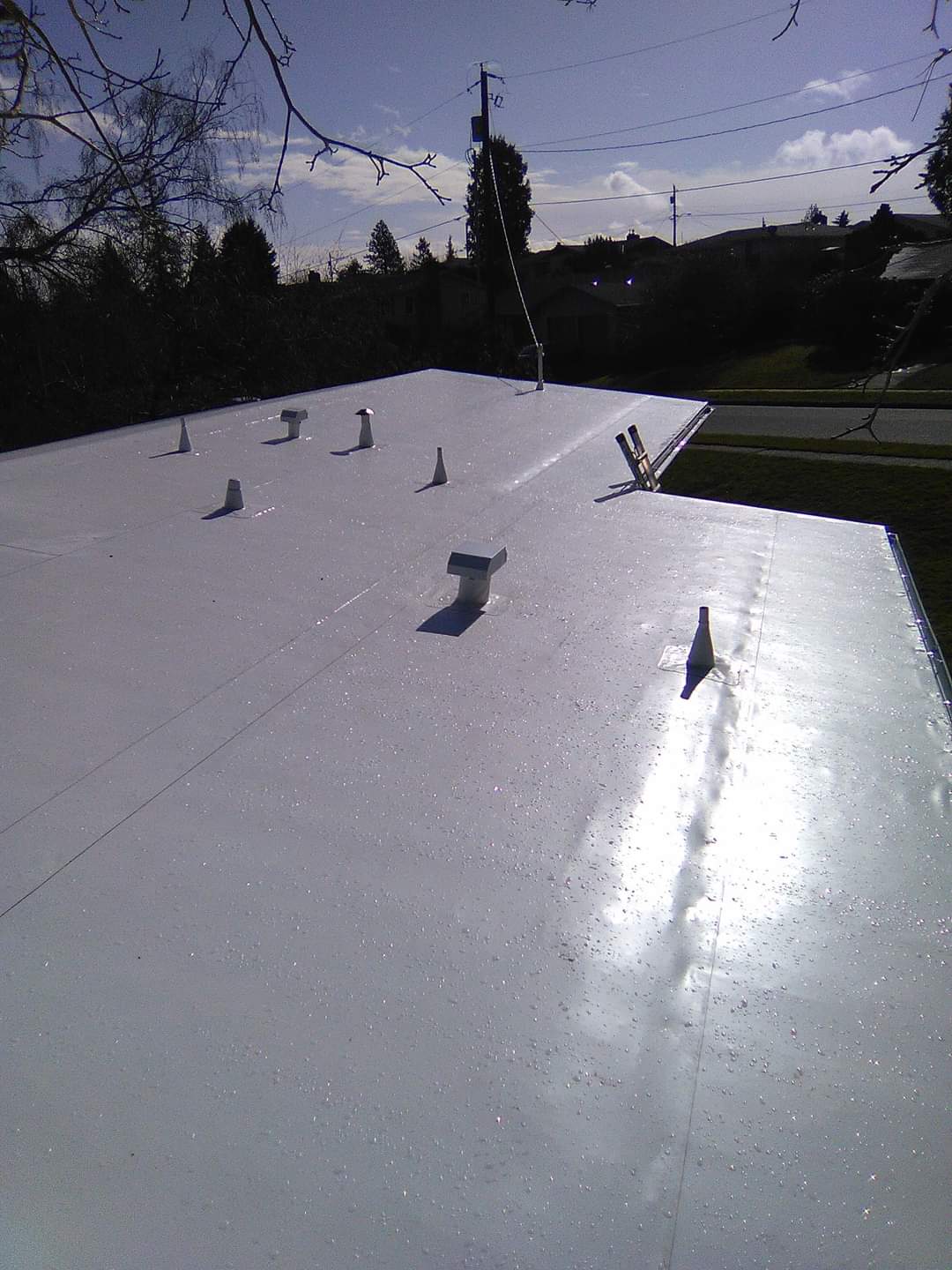 A white roof with a lot of screws on it
