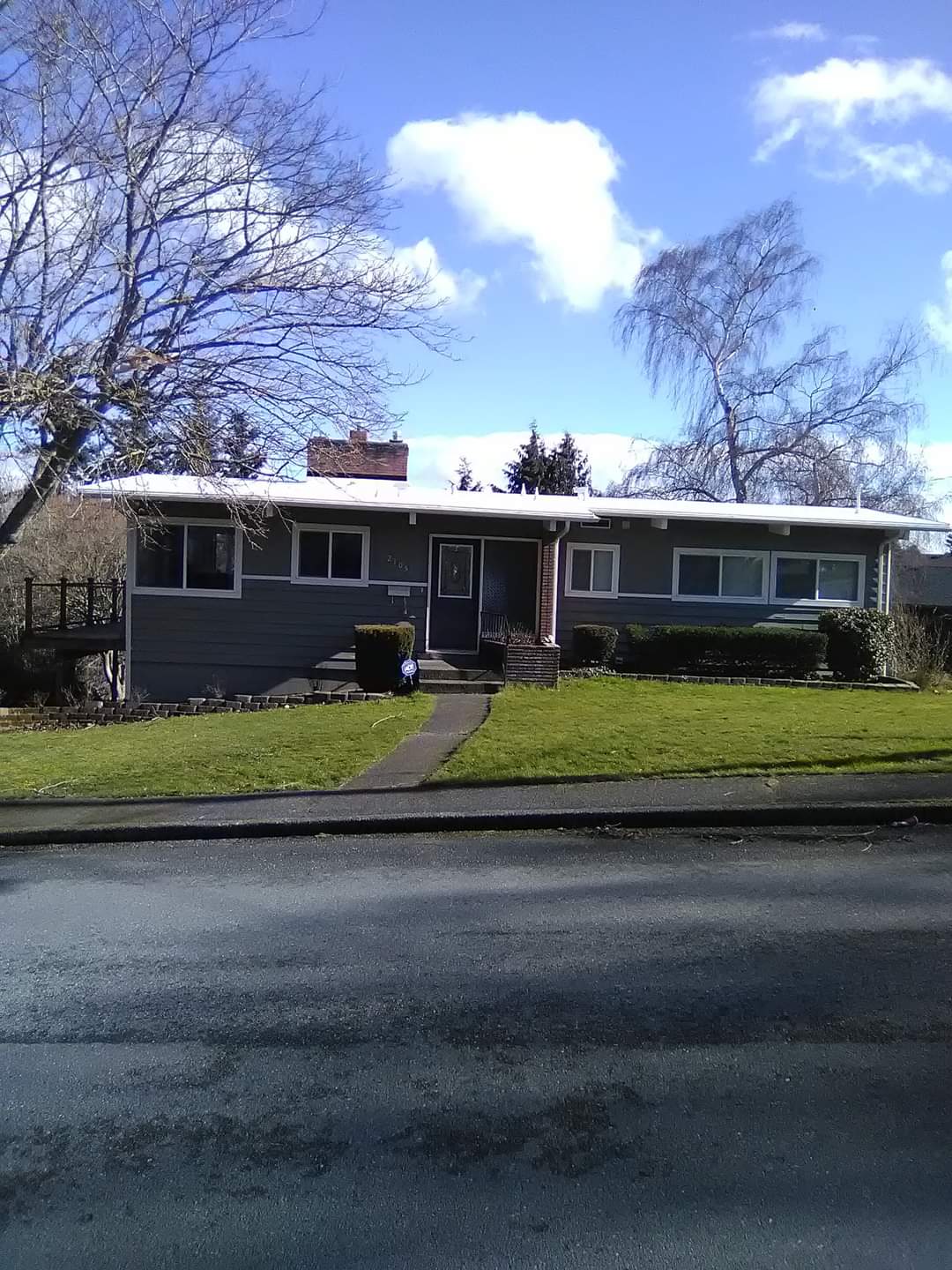 A house with a roof that is covered in snow