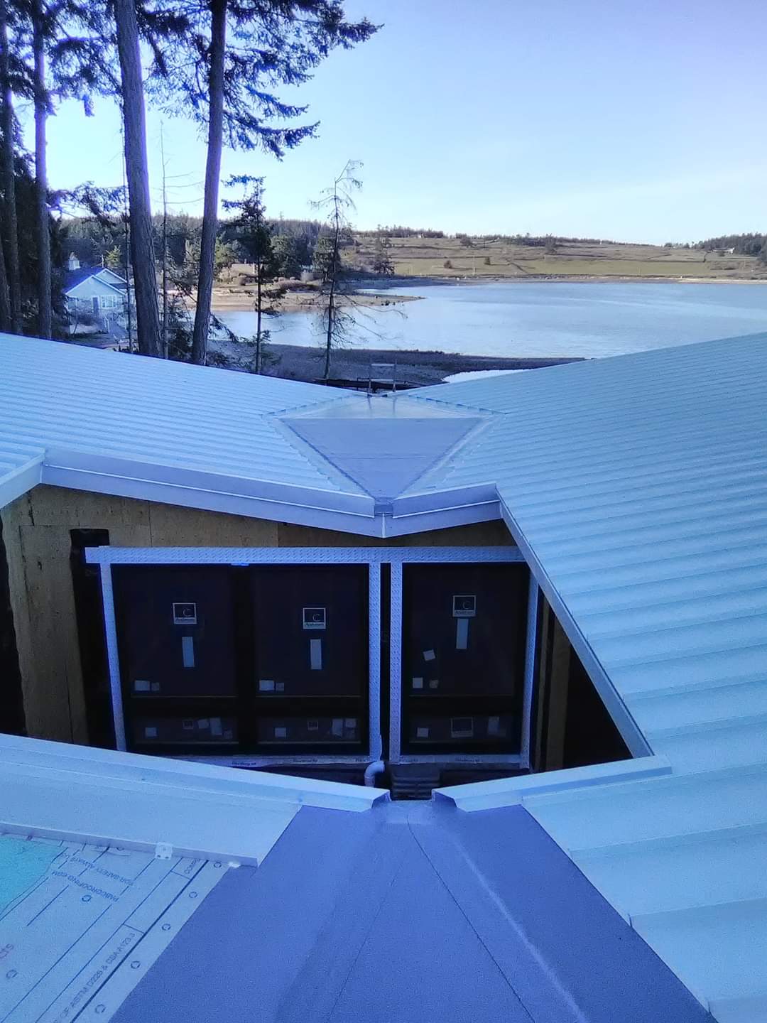 The roof of a building with a view of a lake