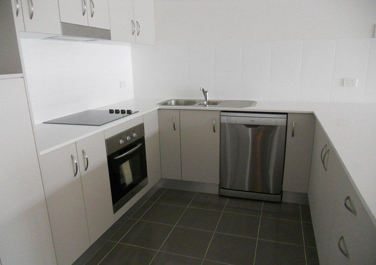 professional cleaning sparkling clean kitchen with stainless steel appliances