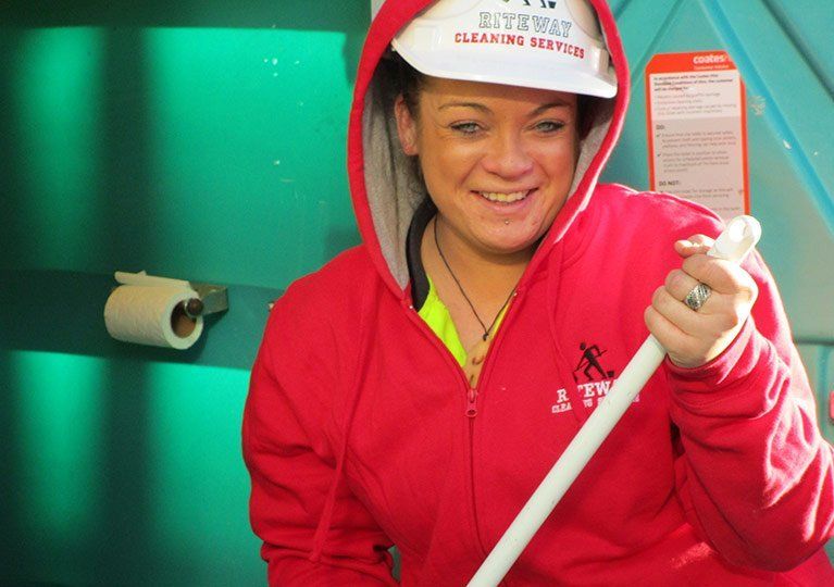 girl cleaning portable toilets