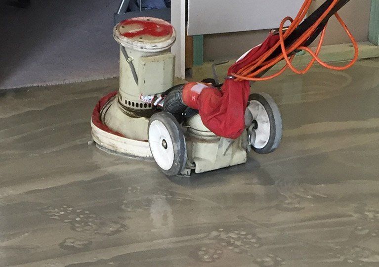 stripping and sealing services floor stripping machine at work