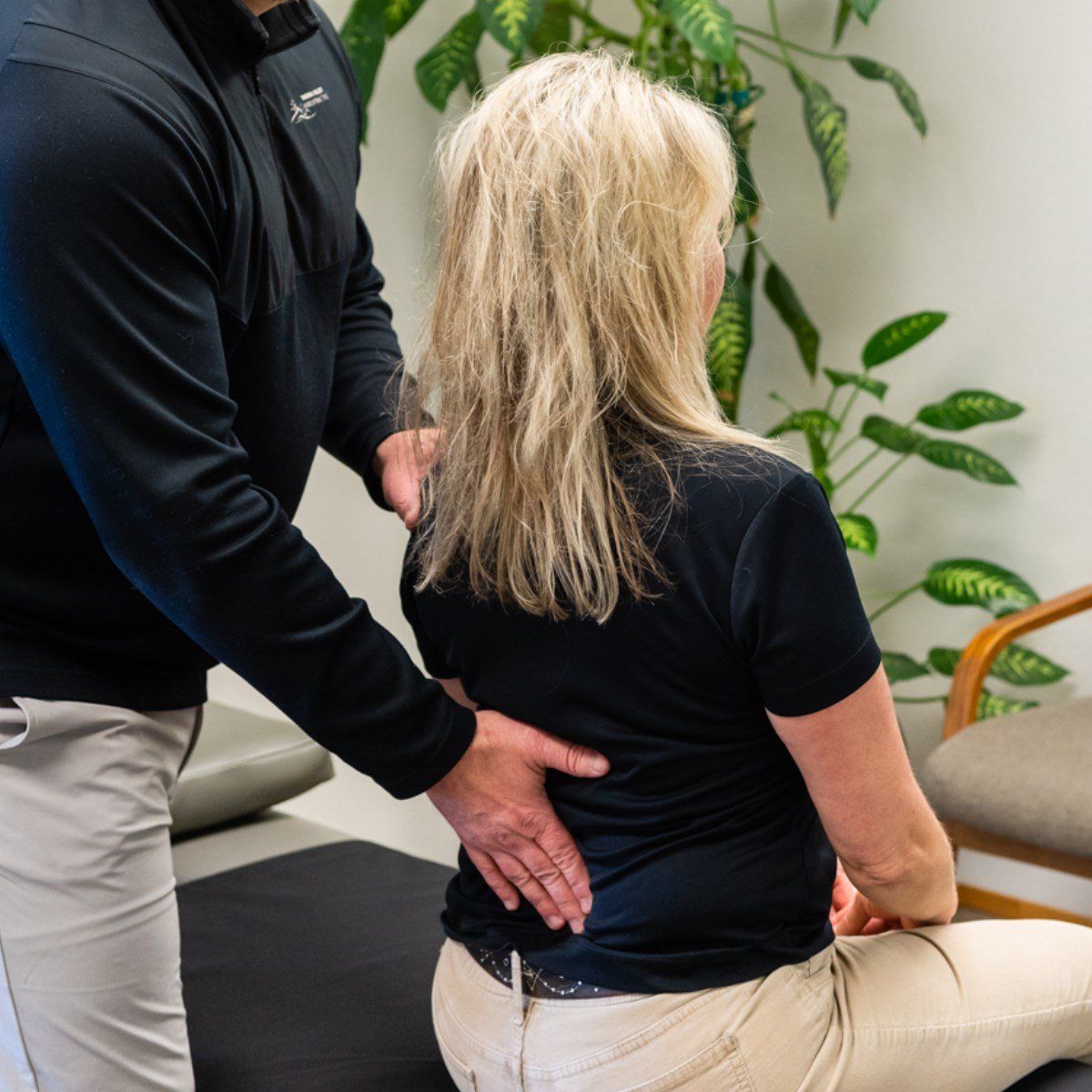 Checking Back Of Patient — Sunnyside, WA — Yakima Valley Chiropractic Center Checking Back Of Patient — Sunnyside, WA — Yakima Valley Chiropractic Center