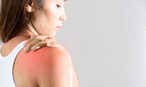 A Woman Checking Her Shoulder — Sunnyside, WA — Yakima Valley Chiropractic Center A Woman Checking Her Shoulder — Sunnyside, WA — Yakima Valley Chiropractic Center