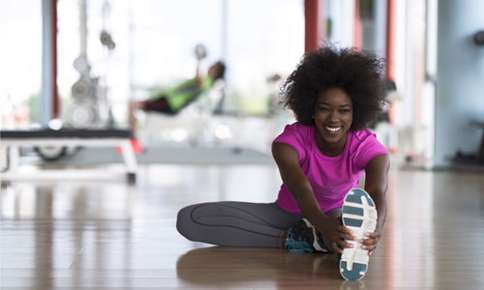 A Happy Woman Stretching — Sunnyside, WA — Yakima Valley Chiropractic Center A Happy Woman Stretching — Sunnyside, WA — Yakima Valley Chiropractic Center