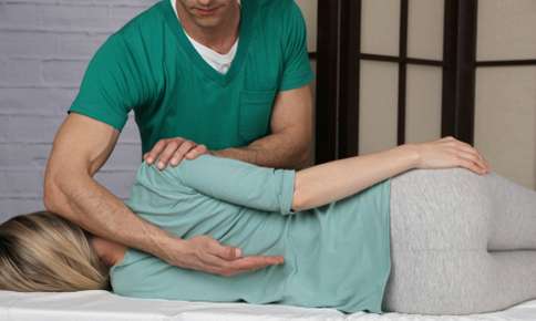 Treating Woman with Chiropractic Adjustment — Sunnyside, WA — Yakima Valley Chiropractic Center Treating Woman with Chiropractic Adjustment — Sunnyside, WA — Yakima Valley Chiropractic Center