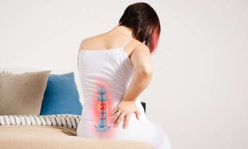 Woman Experiencing Pain in Spine — Sunnyside, WA — Yakima Valley Chiropractic Center Woman Experiencing Pain in Spine — Sunnyside, WA — Yakima Valley Chiropractic Center