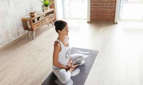 Woman Meditating in a Peaceful Room — Sunnyside, WA — Yakima Valley Chiropractic Center Woman Meditating in a Peaceful Room — Sunnyside, WA — Yakima Valley Chiropractic Center