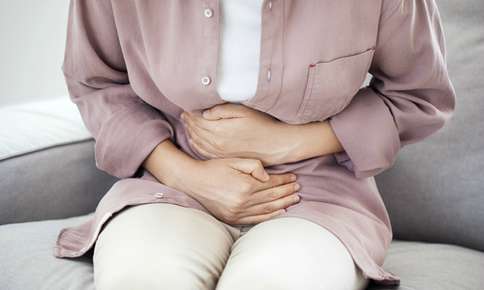 Woman Experiencing Stomach Pain — Sunnyside, WA — Yakima Valley Chiropractic Center Woman Experiencing Stomach Pain — Sunnyside, WA — Yakima Valley Chiropractic Center