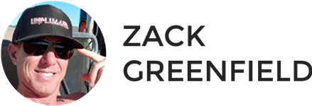 A man wearing sunglasses and a hat with the name zack greenfield on it.