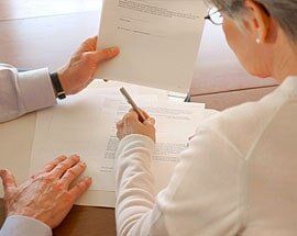 Client signing paper - Law services in Sterling Heights Client signing paper - Law services in Sterling Heights