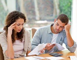 Couple signing paper - Law services in Sterling Heights Couple signing paper - Law services in Sterling Heights