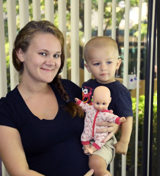 image of girl holding child