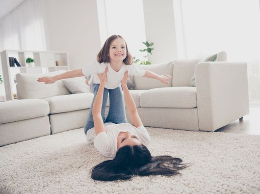 Mother And Daughter Playing On Carpet — Lancaster, OH — Ewing Steam Cleaning Inc. Mother And Daughter Playing On Carpet — Lancaster, OH — Ewing Steam Cleaning Inc.