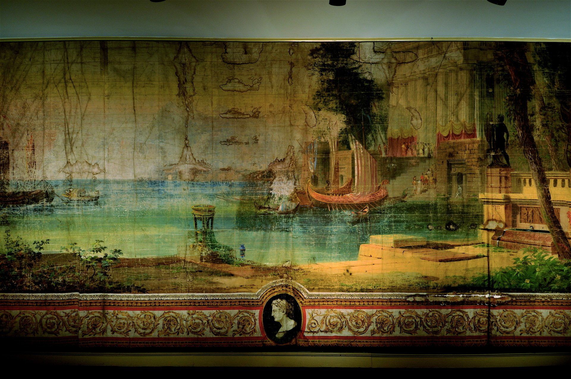 Vintage mural of a harbor scene with sailboats, buildings, and a decorative border