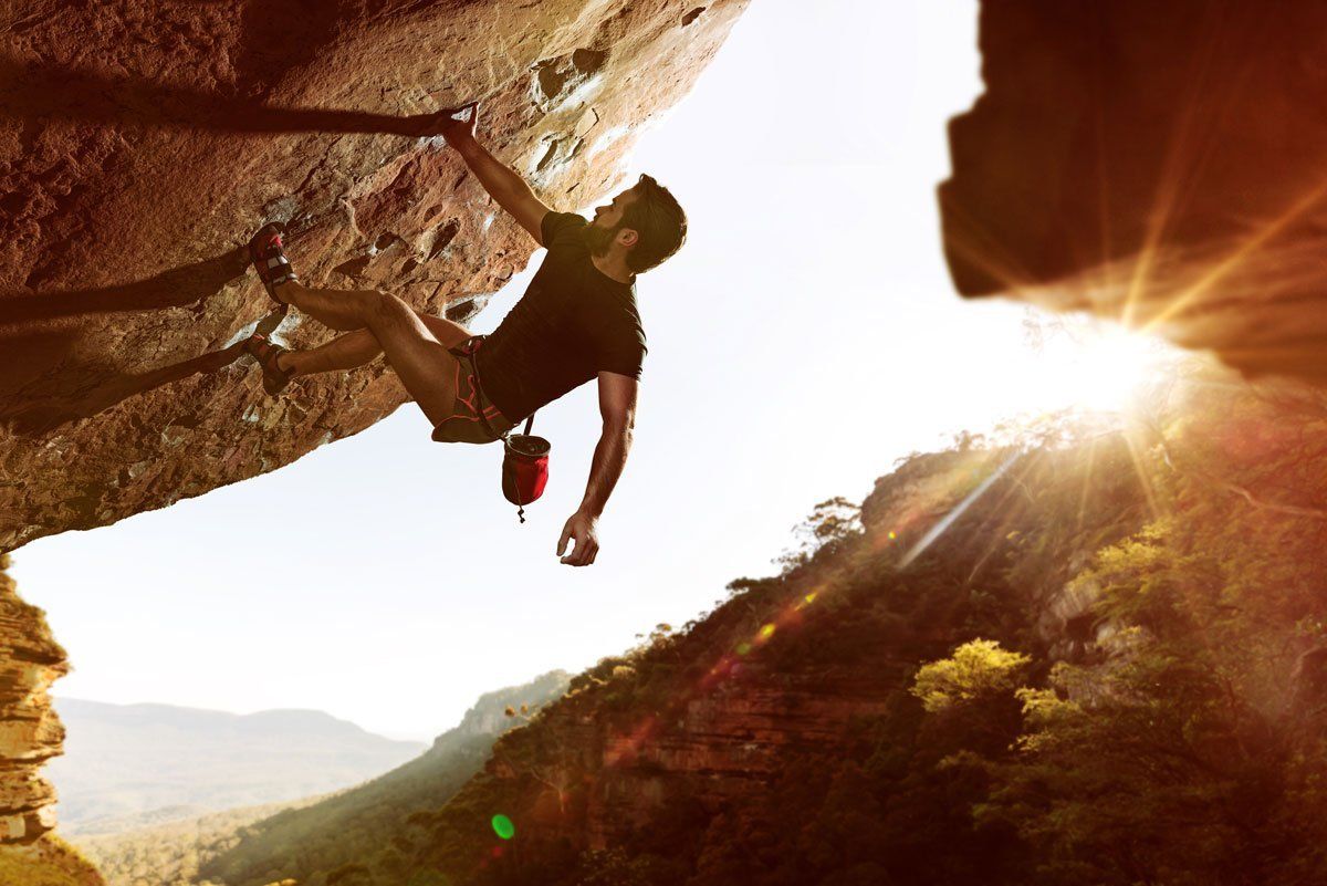 man climbing wall