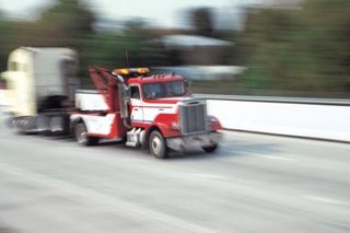 Cab of semi truck being towed down highway - Towing in Wenatchee, WA Cab of semi truck being towed down highway - Towing in Wenatchee, WA