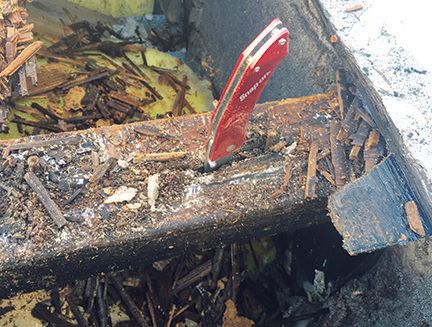 Rotten roof truss embedded in masonry pocket with pocket knife