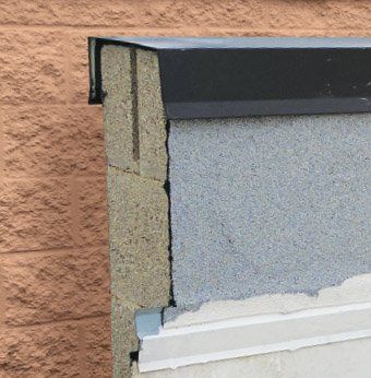 Metal coping on split face block wall missing end cap, Chicago