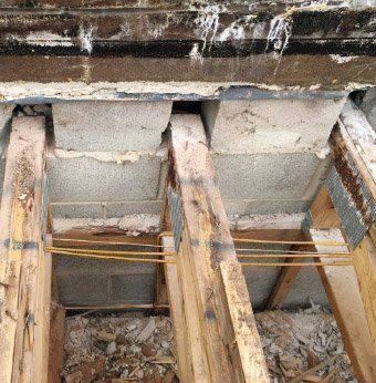 Water damaged roof trusses being repaired /reinforced by WickRight General Contracting